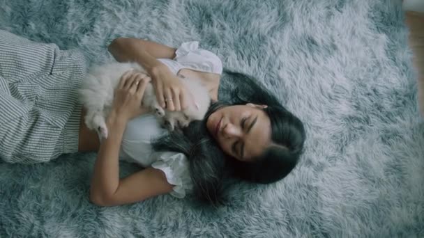 Young Thai Woman Holding Lifting Cute White Spitz Dog Lying — Stock Video