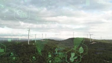 Aerial view of powerful Wind turbine farm for energy production on beautiful cloudy sky at highland. Wind power turbines generating clean renewable energy for sustainable development. 4k footage. High