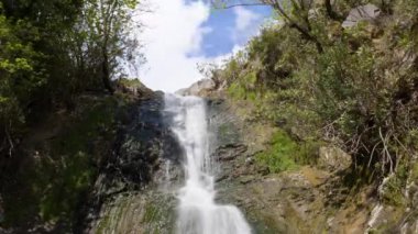 Beautiful waterfall in green forest, top view. Tropical in mountain jungle. Waterfall in the tropical forest. Big Waterfall in 4k. High quality 4k footage