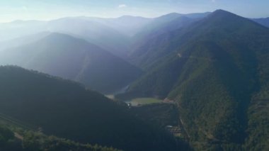 Beautiful landscape in aerial drone shot. Forest woods and calm tranquil lake. . High quality 4k footage