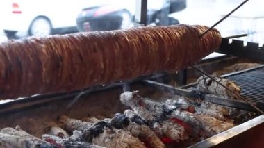 Kokorec with oil flowing left to bake. High quality 4k footage