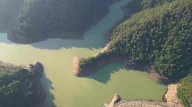 Aerial drone footage top view Water dam and reservoir lake, generating hydro electricity power renewable energy and sustainable development. . High quality 4k footage. High quality 4k footage
