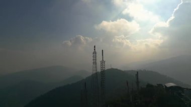 Footage 4k B-roll Aerial drone view of tower antennas Telecommunication cell phone, radio transmitters of cellular 5g 4g mobile and smartphones. High quality 4k footage