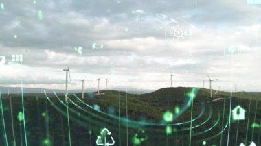 Aerial view of powerful Wind turbine farm for energy production on beautiful cloudy sky at highland. Wind power turbines generating clean renewable energy for sustainable development. 4k footage. High