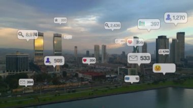 Social media icons fly over city downtown showing people engagement connection through social network application platform . Concept for online community and social media marketing strategy . High