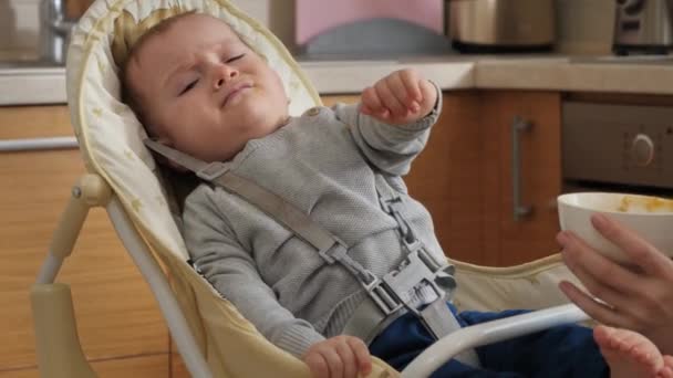 Portrait Baby Crying Refusing Eat Highchair Kitchen Concept Parenting Healthy — Vídeo de stock