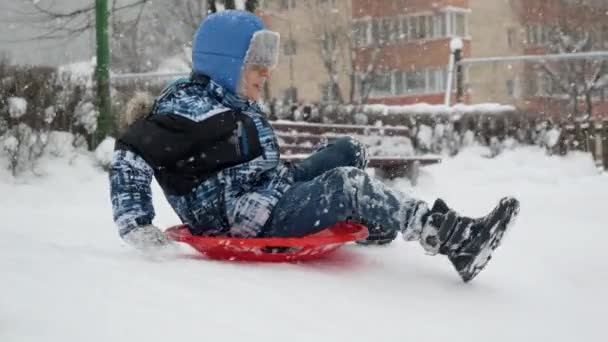 Slow Motion Cheerful Smiling Boy Having Fun Winter Holidays Riding — Stock Video