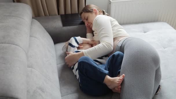 Mother Breastfeeds Her Baby Son Sofa Creating Loving Secure Environment — Stock Video