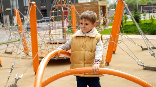 Portrait Happy Smiling Boy Spinning Carousel Having Fun Public Playground — Stock Photo, Image