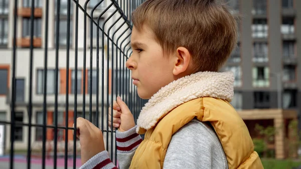 Portrait Sad Little Boy Looking Metal Fence Child Depression Problems — Stock Photo, Image