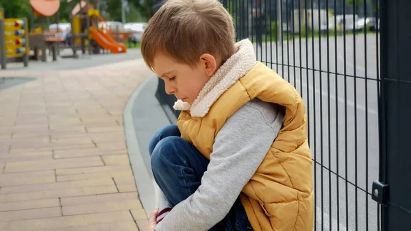 Portrait Little Boy Crying While Sitting Alone Next Metal Fence — Stock Photo, Image