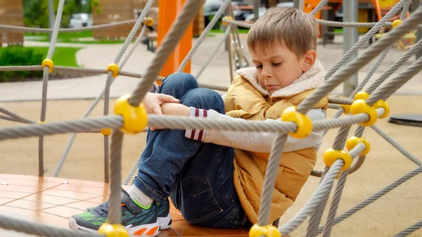 Upset Lonely Boy Sitting Playground Embracing His Legs Child Depression — Stock Photo, Image