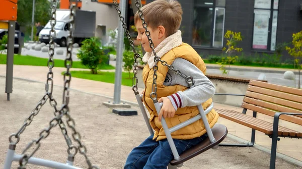 Slow Motion Happy Smiling Boy Swinging Chain Swing Public Playground — Stock Photo, Image