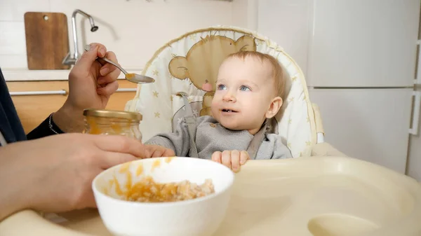 Portrait Little Baby Boy Getting Messy While Eating Porridge Highchair — Stok fotoğraf