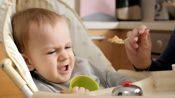 Portrait Angry Screaming Baby Boy Refusing Eating Food While Sitting — Stock Photo, Image