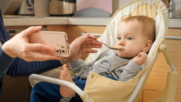Portrait Little Baby Boy Watching Cartoons Smartphone While Eating Porridge — Stock Photo, Image