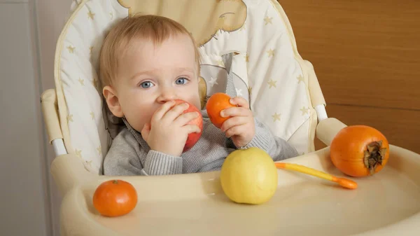 Portrait Little Baby Boy Sitting Highchair Eating Fruits Kitchen Concept — 图库照片