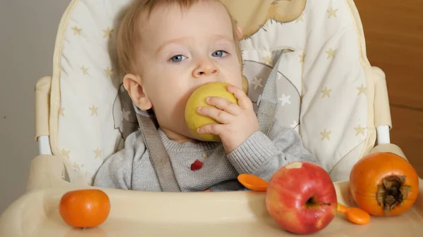 Portrait Little Baby Boy Sitting Highchair Biting Fresh Apple Concept — Stok fotoğraf