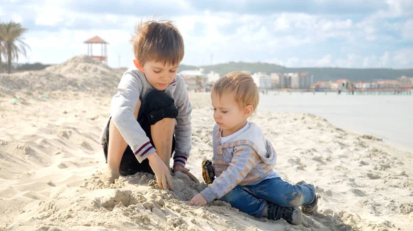 Two Happy Boys Playin Sea Enjoying Building Sand Castle Concept — Stock Photo, Image