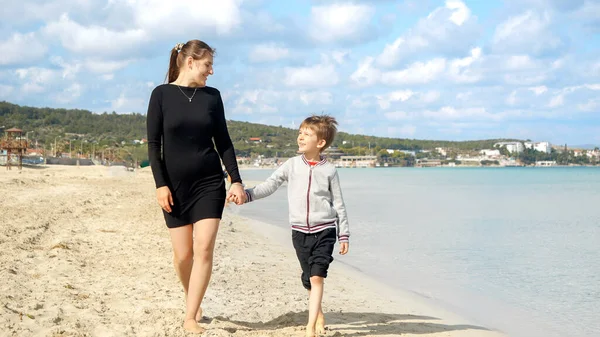 Happy Cheerful Mother Son Holding Hands Walkig Sandy Sea Beach — Stock Photo, Image