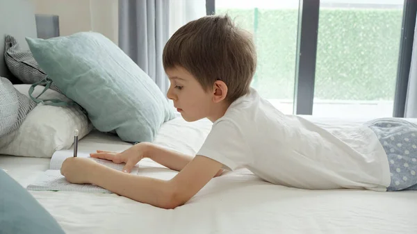 Little Boy Wearing Pajamas Doing Homework Bed Waking Morning Concept — Stock Photo, Image