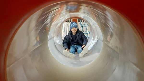 Little Boy Sliding Tube Slide Public Playground Happy Kids Fun — Stock Photo, Image