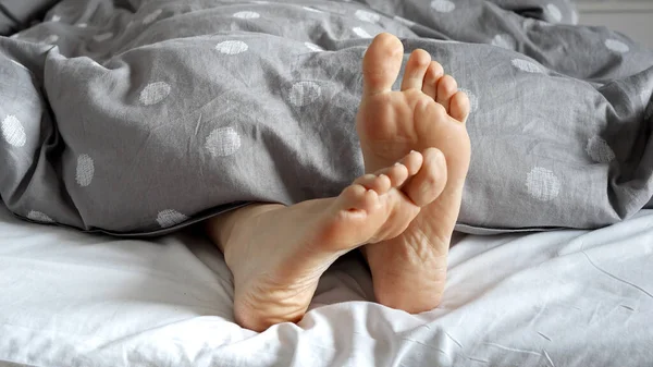 Closeup Pair Feet Belonging Woman Visible Blankets Cozy Bed Calm — Stock Photo, Image