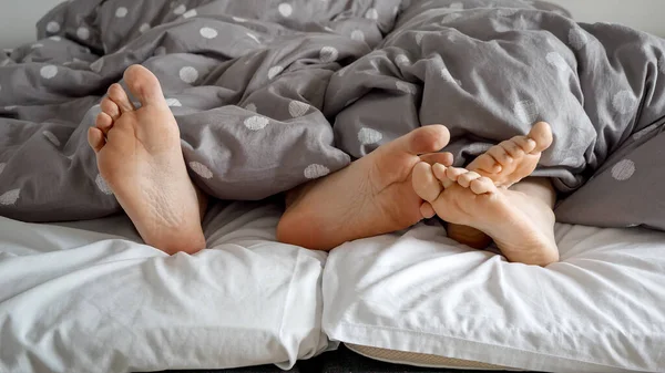 Closeup Man Woman Feet Sticking Out Covers Share Moment Intimacy — Stock Photo, Image