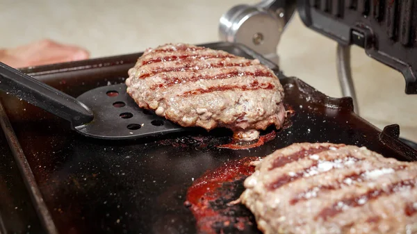 Closeup Turning Beef Burger Patties Cooking Electric Grill Cooking Home — Stock Photo, Image