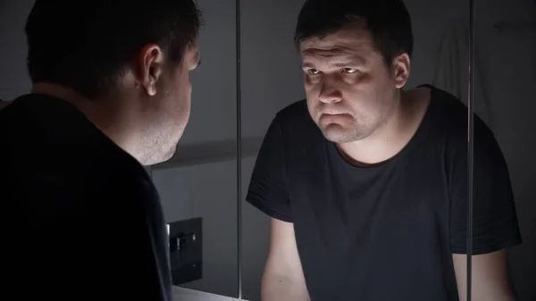 Upset Angry Man Black Shirt Looking His Reflection Bathroom — Stock Photo, Image