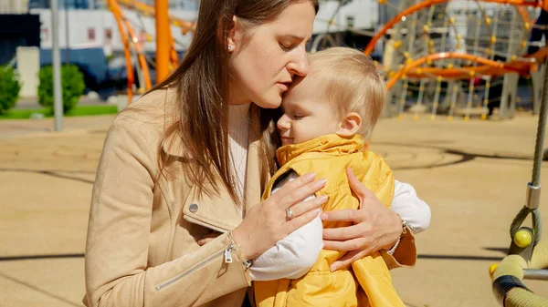Young Mother Consoling Hugging Her Upset Baby Boy Playground Children — Stock Photo, Image