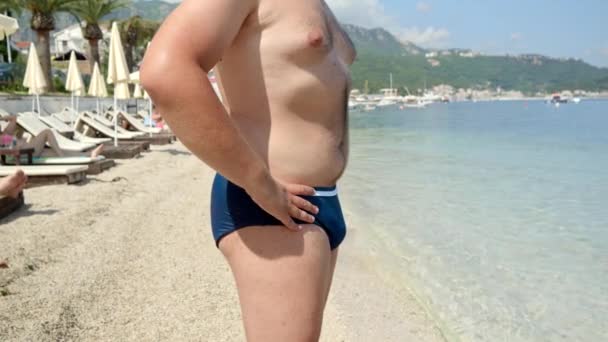 Closeup Obese Young Man Seaside Taking Moment Manage His Belly — Stock Video