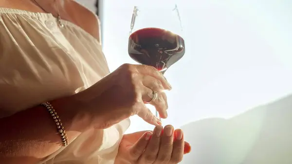 Closeup Sun Shining Glass Red Wine Held Woman Relaxing Villa — Stock Photo, Image