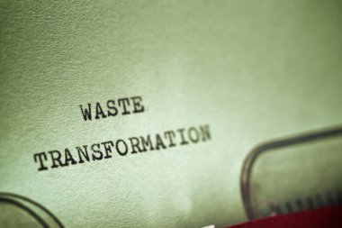 Bir daktilo ile yazılmış atık dönüşüm ifadesi.