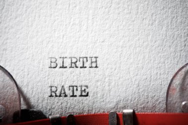 Birth rate text written with a typewriter. clipart