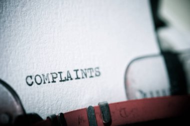 Complaints word written with a typewriter. clipart