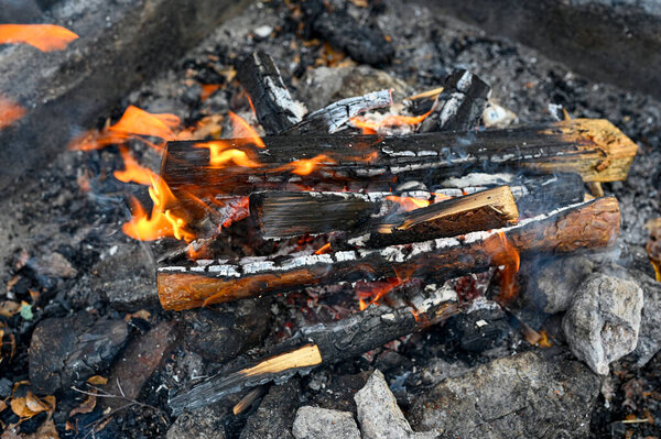 small fire at fireplace near walking trail Kumla Sweden october 31 2022