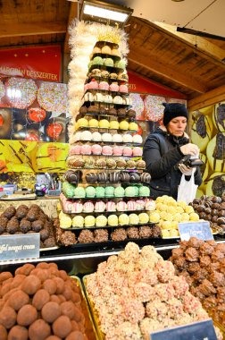 market stand with balls of marzipan candy at Szent Istvan Ter Budapest Hungary november 22 2022