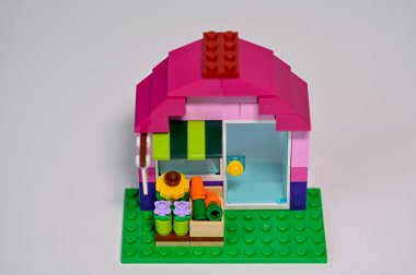 little house built of lego blocks on white table Sweden january 2023
