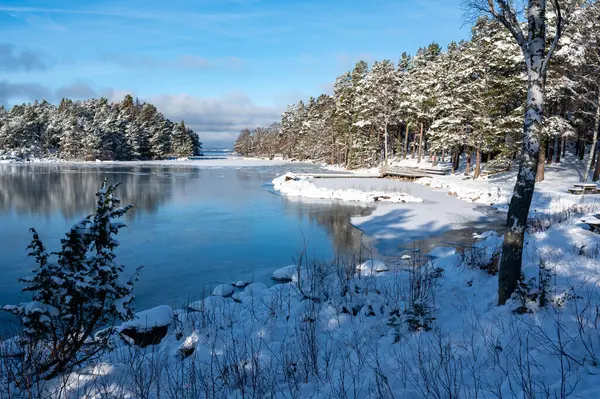 sunlight over frozen swimming area in Lake Vattern Motala Sweden February 9 2024