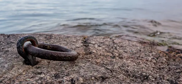 stock image Old rusty mooring ring in rock near lake Vattern Motala Sweden September 20 2024