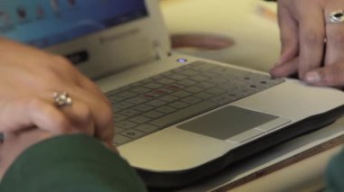 Hands of a Blind or Visually Impaired Student Learning to Use a Computer in Class Inside a School for the Blind. Close Up. 