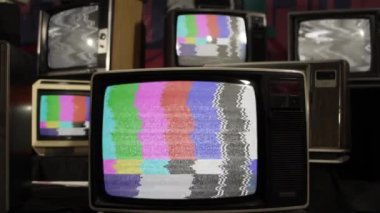 Retro TV Turning On Chroma Key Green Screen Among Many Vintage Televisions with Static Noise and Test Pattern Signal. Close Up.  