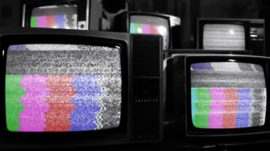 Retro TV Turning On Chroma Key Green Screen Among Many Vintage Televisions with Static Noise and Test Pattern Signal. Close Up. Black and White Tone. You can replace green screen with the footage or picture you want.  