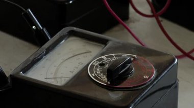 An Old Analog Multimeter at the Workshop of a Prison. Close Up.  