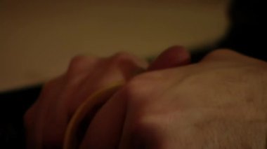 Hands of a Man Peeling an Orange. Close Up. 