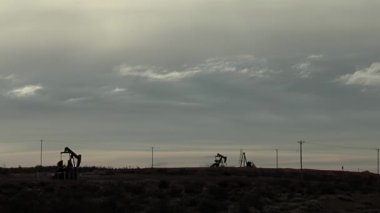 Pumpjacks extract Oil from an Oilfield in the Neuquen Basin in northern Patagonia, Argentina. 