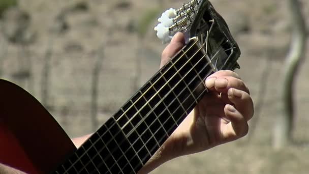 Man Tuning Spanish Guitar Outdoors Close — Stock Video