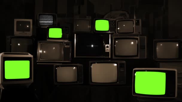 Stapel Vintage Televisies Arranged One Top Another Turning Green Screens — Stockvideo