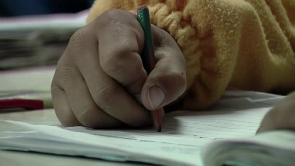 Hand Male School Boy Holding Black Pencil While Writing His — Stock Video
